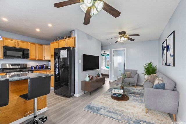 3003 Ala Napuaa Pl Unit 401, Honolulu, HI 96818 - living area featuring ceiling fan, light wood finished floors, recessed lighting, and baseboards