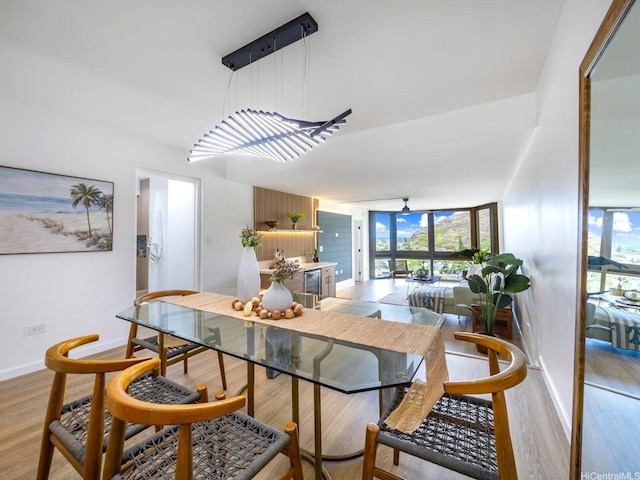 501 Hahaione St Unit 111D, Honolulu, HI 96825 - dining space featuring light wood finished floors and baseboards