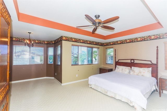 91-1027 Kaikoele St, Ewa Beach, HI 96706 - bedroom featuring baseboards, carpet flooring, a raised ceiling, a chandelier, and a ceiling fan