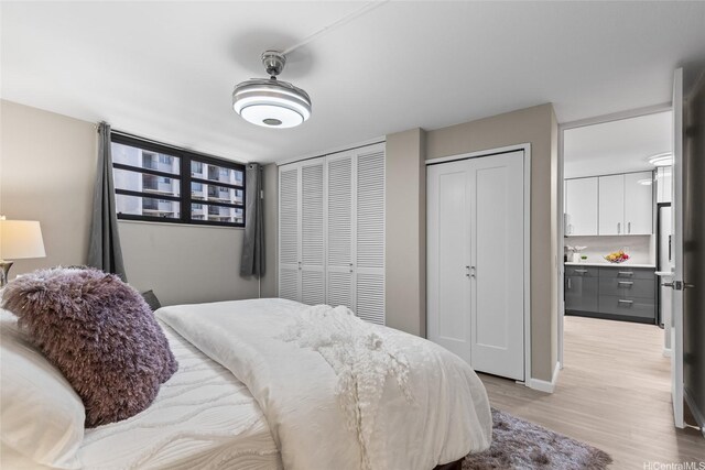 750 Kaheka St Unit 901, Honolulu, HI 96814 - bedroom featuring light wood finished floors
