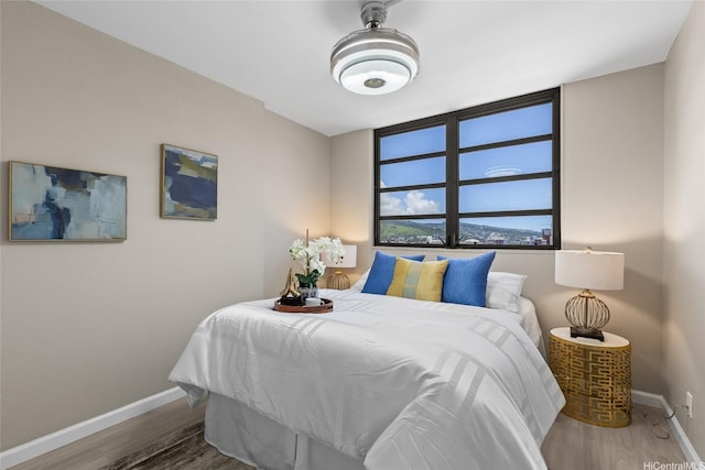 750 Kaheka St Unit 901, Honolulu, HI 96814 - bedroom with baseboards and wood finished floors