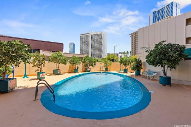 750 Kaheka St Unit 901, Honolulu, HI 96814 - community pool with a patio area, fence, and a city view