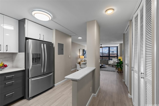 750 Kaheka St Unit 901, Honolulu, HI 96814 - kitchen with stainless steel fridge with ice dispenser, light countertops, and light wood-style flooring