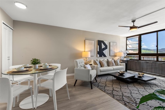 750 Kaheka St Unit 901, Honolulu, HI 96814 - living room with light wood-type flooring, ceiling fan, and baseboards