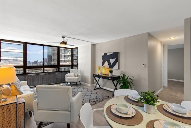 750 Kaheka St Unit 901, Honolulu, HI 96814 - living area with baseboards, healthy amount of natural light, wood finished floors, and a ceiling fan