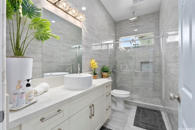 45-333 Mahalani St, Kaneohe, HI 96744 - full bathroom with tile walls, a stall shower, vanity, toilet, and tile patterned floors