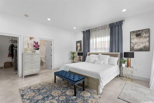 45-333 Mahalani St, Kaneohe, HI 96744 - bedroom featuring a walk in closet, light tile patterned floors, recessed lighting, ensuite bath, and a closet
