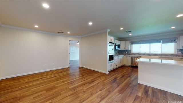 84-575 Kili Dr Unit 8, Waianae, HI 96792 - kitchen with stainless steel appliances, ornamental molding, decorative backsplash, light countertops, and recessed lighting