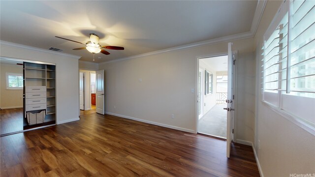 84-575 Kili Dr Unit 8, Waianae, HI 96792 - unfurnished bedroom with dark wood-type flooring, baseboards, ornamental molding, and a closet