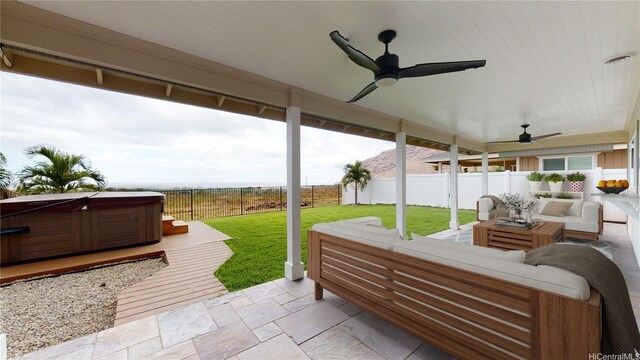 84-575 Kili Dr Unit 8, Waianae, HI 96792 - view of patio / terrace featuring a hot tub, ceiling fan, and an outdoor hangout area
