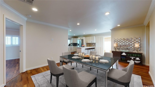 84-575 Kili Dr Unit 8, Waianae, HI 96792 - dining area featuring ornamental molding, baseboards, recessed lighting, and wood finished floors