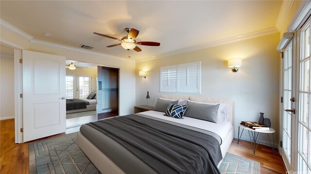 84-575 Kili Dr Unit 8, Waianae, HI 96792 - bedroom with french doors, wood finished floors, ornamental molding, a closet, and baseboards