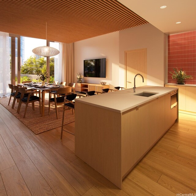 1538 Kapiolani Blvd Unit 903, Honolulu, HI 96814 - kitchen with a sink, light countertops, light wood-type flooring, modern cabinets, and recessed lighting