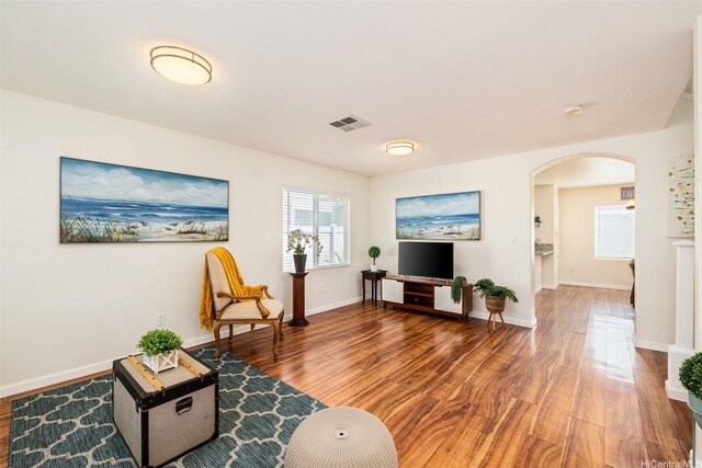 91-6414 Kapolei Pkwy, Ewa Beach, HI 96706 - living area with arched walkways, wood finished floors, and baseboards