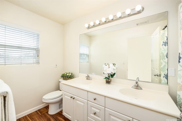 91-6414 Kapolei Pkwy, Ewa Beach, HI 96706 - full bathroom with toilet, double vanity, wood finished floors, and baseboards