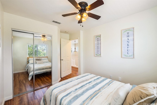 91-6414 Kapolei Pkwy, Ewa Beach, HI 96706 - bedroom featuring dark wood-style floors, a closet, baseboards, and a ceiling fan