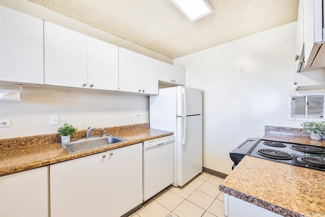 1805 Poki St Unit 1101, Honolulu, HI 96822 - kitchen with white appliances, a sink, white cabinetry, light tile patterned floors, and baseboards