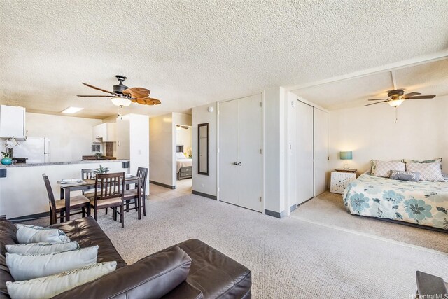 1805 Poki St Unit 1101, Honolulu, HI 96822 - living room with ceiling fan, a textured ceiling, and light carpet
