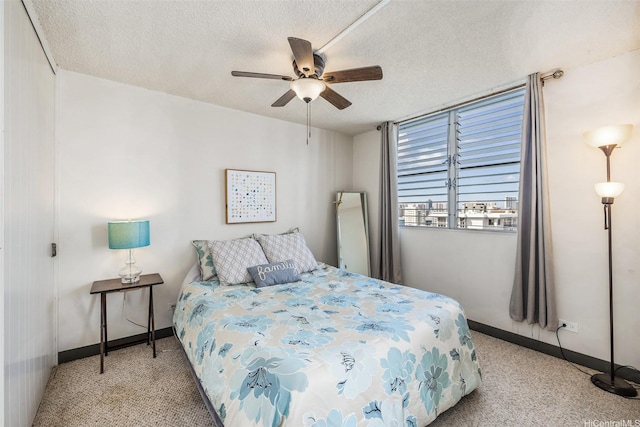 1805 Poki St Unit 1101, Honolulu, HI 96822 - bedroom featuring carpet, a textured ceiling, baseboards, and ceiling fan