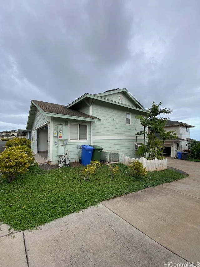 92-7049 Elele St Unit 71, Kapolei, HI 96707 - view of home's exterior featuring a garage and fence