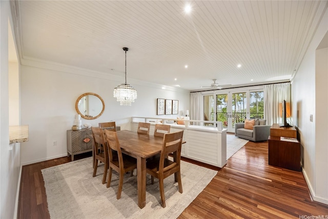 dining space featuring light wood finished floors, ceiling fan with notable chandelier, crown molding, baseboards, and recessed lighting