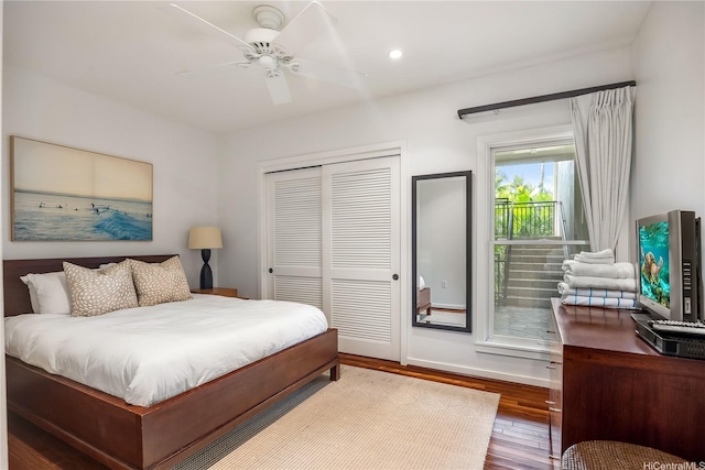 bedroom with a closet, recessed lighting, baseboards, ceiling fan, and wood finished floors
