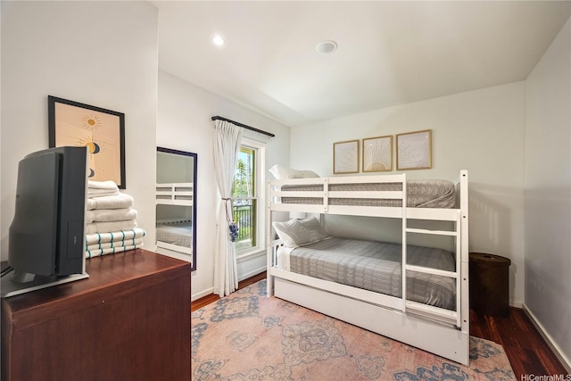 bedroom with access to outside, wood finished floors, baseboards, and recessed lighting