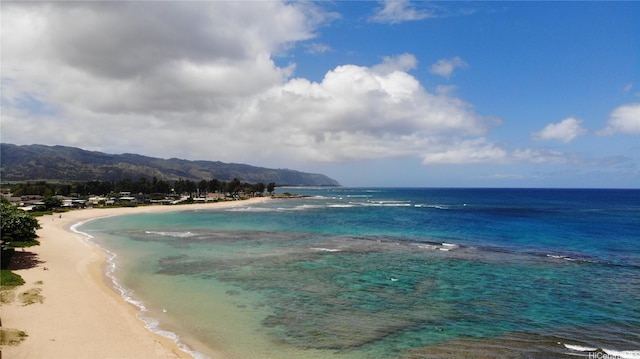 property view of water featuring a mountain view and a view of the beach