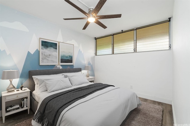 95-2027 Waikalani Pl Unit A102, Mililani, HI 96789 - bedroom featuring wood finished floors, a ceiling fan, and baseboards