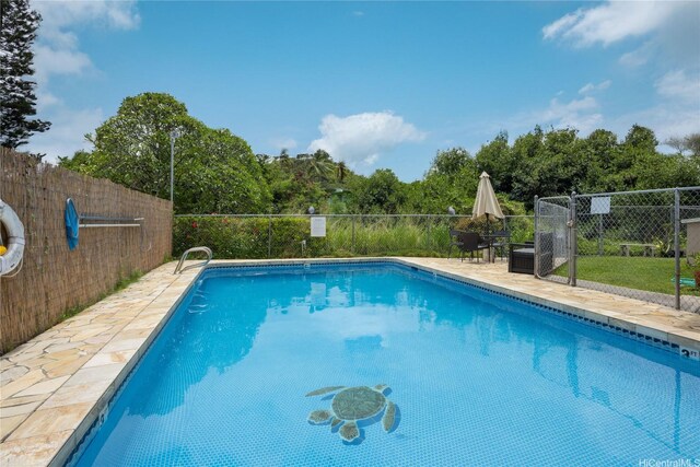 75 Kihapai St Unit 11, Kailua, HI 96734 - view of swimming pool with fence, a patio, and view of wooded area