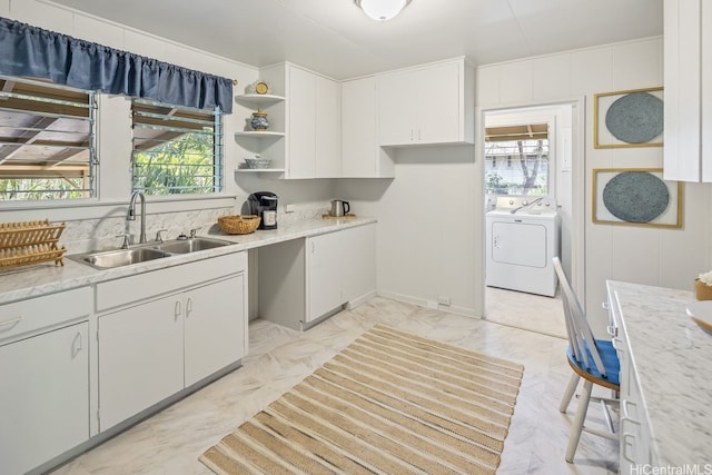 2023 Round Top Dr, Honolulu, HI 96822 - kitchen with a sink, open shelves, independent washer and dryer, and white cabinets