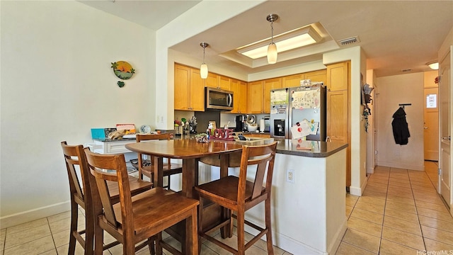 92-1490 Aliinui Dr Unit 803, Kapolei, HI 96707 - kitchen featuring stainless steel appliances, dark countertops, light tile patterned floors, and baseboards