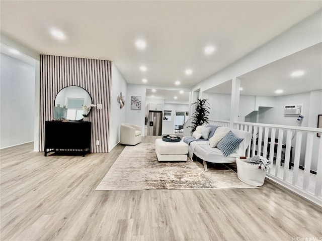 87-224 Laulele St, Waianae, HI 96792 - living room with wood finished floors, an AC wall unit, and recessed lighting