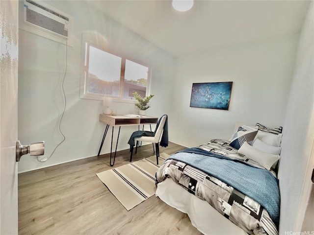 87-224 Laulele St, Waianae, HI 96792 - bedroom with a wall unit AC and wood finished floors