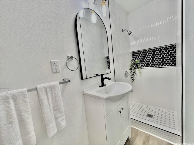 87-224 Laulele St, Waianae, HI 96792 - full bathroom with a shower, vanity, wood finished floors, and a textured wall