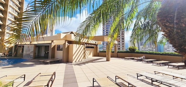 view of patio with a community pool