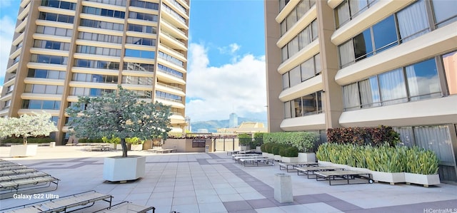 view of home's community with a patio and a mountain view