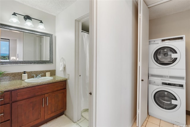 322 Aoloa St Unit 1403, Kailua, HI 96734 - full bath with stacked washer and clothes dryer, tile patterned floors, and vanity