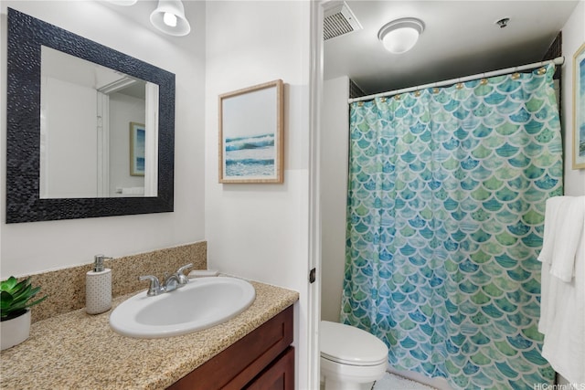 322 Aoloa St Unit 1403, Kailua, HI 96734 - bathroom with toilet, vanity, and curtained shower