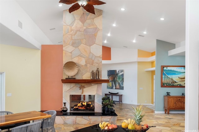 31-212 Hawaii Belt Rd, Hakalau, HI 96710 - living area with ceiling fan, a multi sided fireplace, recessed lighting, vaulted ceiling, and baseboards