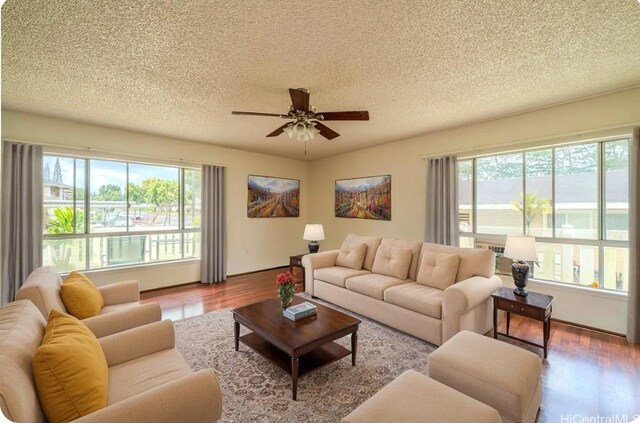 95-1059 Koolani Dr Unit 2, Mililani, HI 96789 - living room featuring a wealth of natural light, a textured ceiling, and wood finished floors