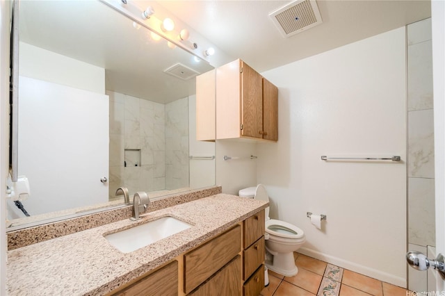 95-1059 Koolani Dr Unit 2, Mililani, HI 96789 - full bathroom featuring toilet, baseboards, visible vents, tile patterned flooring, and vanity
