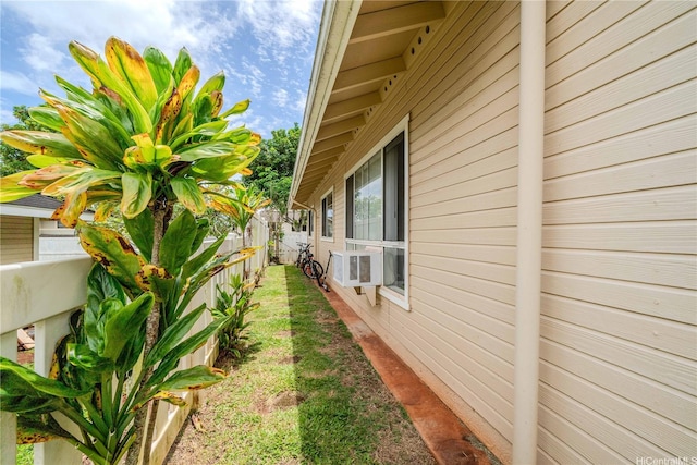 95-1059 Koolani Dr Unit 2, Mililani, HI 96789 - view of property exterior with a fenced backyard and cooling unit