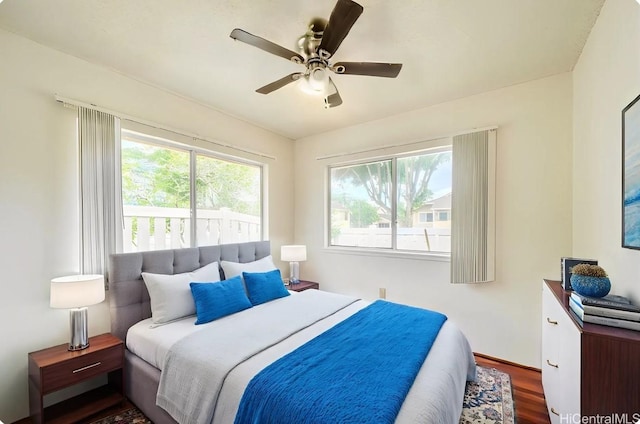 95-1059 Koolani Dr Unit 2, Mililani, HI 96789 - bedroom with a ceiling fan, baseboards, and wood finished floors