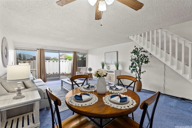 94-1061 Anania Cir Unit 33, Mililani, HI 96789 - carpeted dining space with a textured ceiling, ceiling fan, and stairs