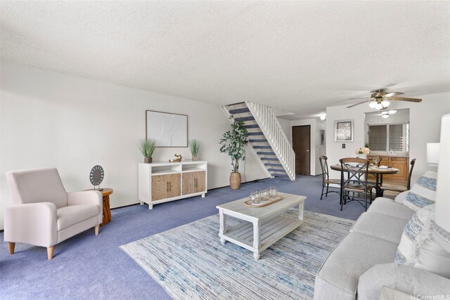 94-1061 Anania Cir Unit 33, Mililani, HI 96789 - carpeted living area featuring stairs, a ceiling fan, a textured ceiling, and baseboards