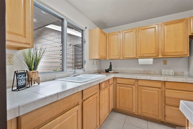 94-1061 Anania Cir Unit 33, Mililani, HI 96789 - kitchen with a sink, light brown cabinetry, plenty of natural light, and light tile patterned floors