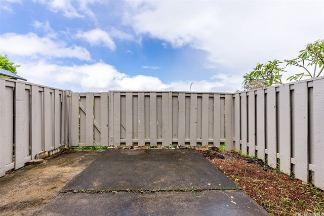 94-1061 Anania Cir Unit 33, Mililani, HI 96789 - view of patio featuring a fenced backyard and a gate