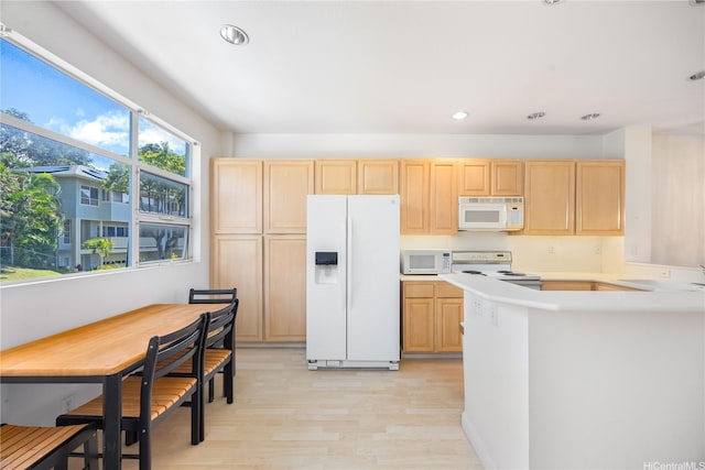1305 Moanalualani Pl Unit 25C, Honolulu, HI 96819 - kitchen featuring white appliances, light brown cabinets, light wood-style flooring, light countertops, and recessed lighting