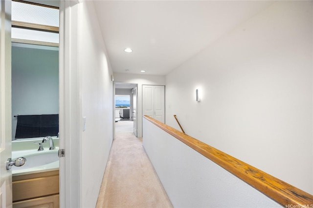 1305 Moanalualani Pl Unit 25C, Honolulu, HI 96819 - hallway with light colored carpet, an upstairs landing, and recessed lighting